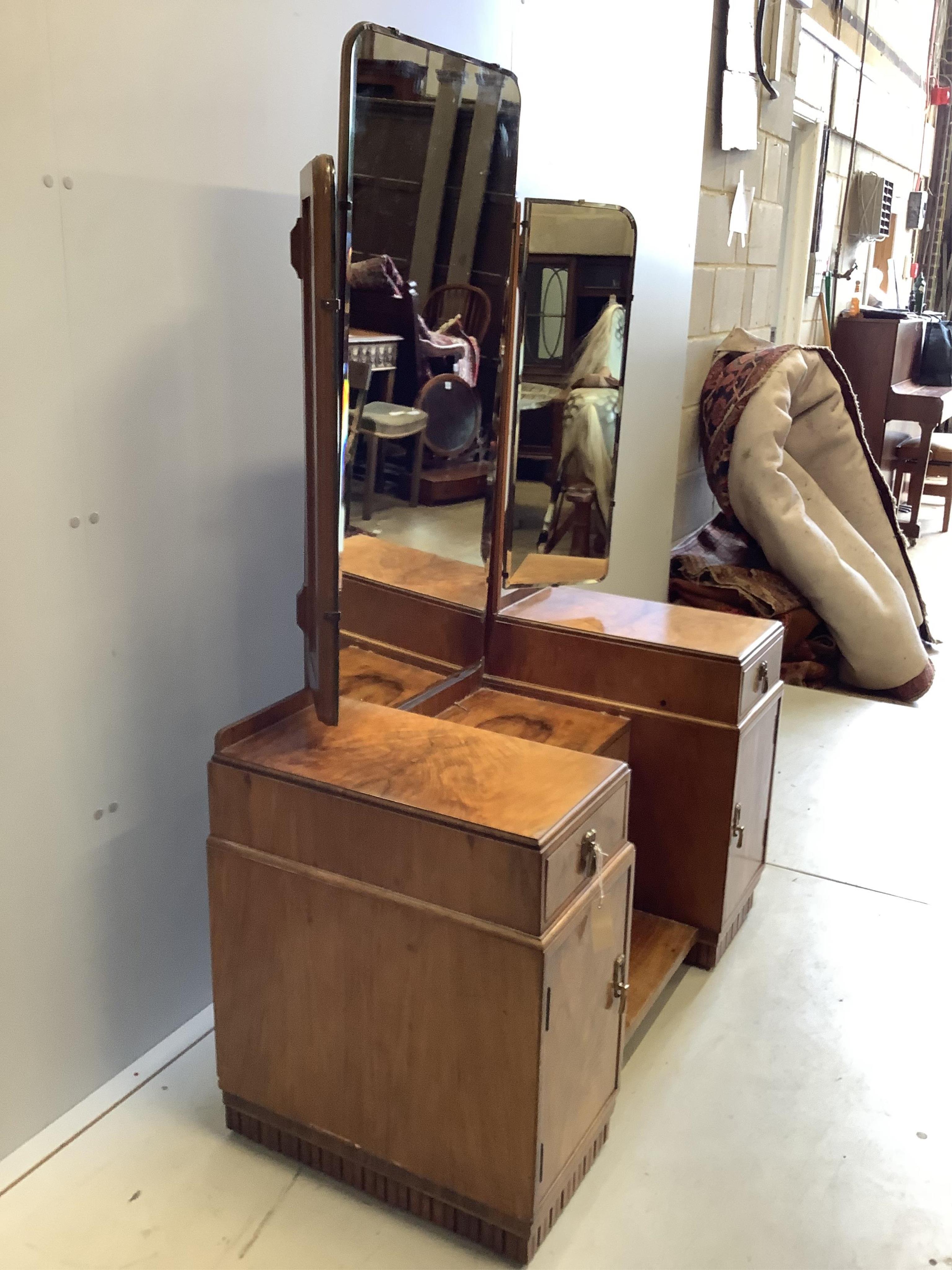 An Art Deco walnut dressing table, width 107cm, height 154cm. Condition - fair to good